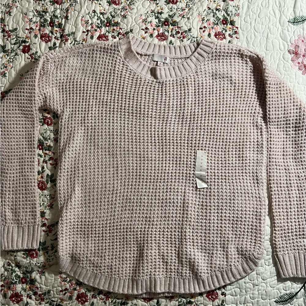 Pink sweater knitted